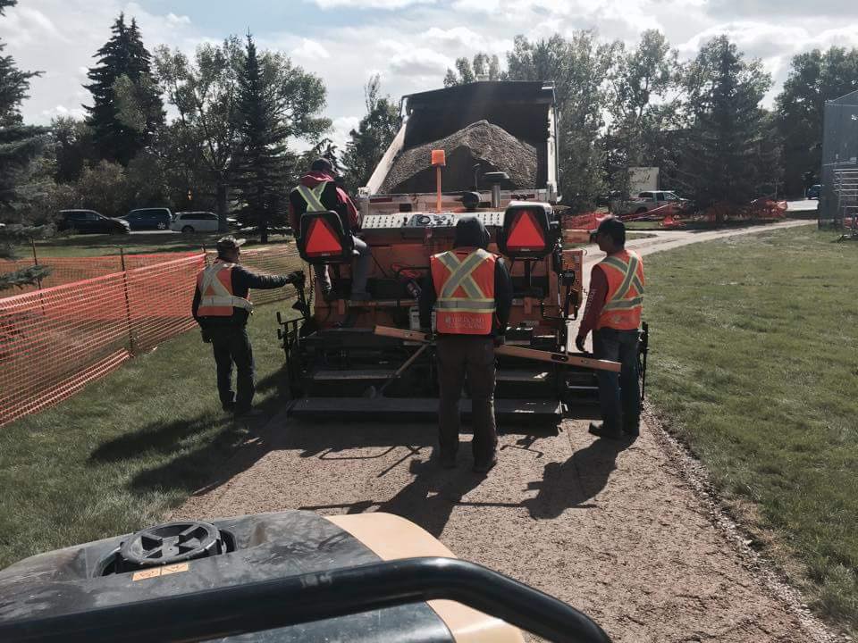 Hudson's Asphalt crew paving a driveway in Calgary